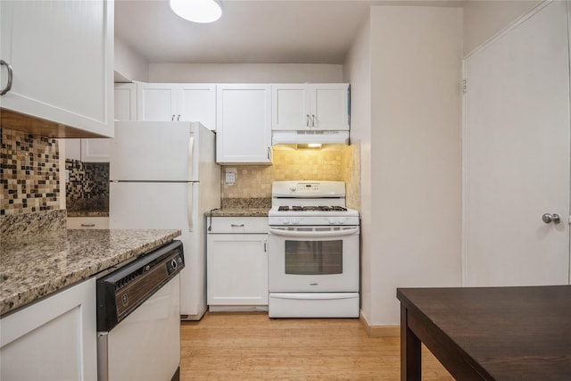 kitchen with white appliances, light hardwood / wood-style floors, white cabinetry, and light stone counters