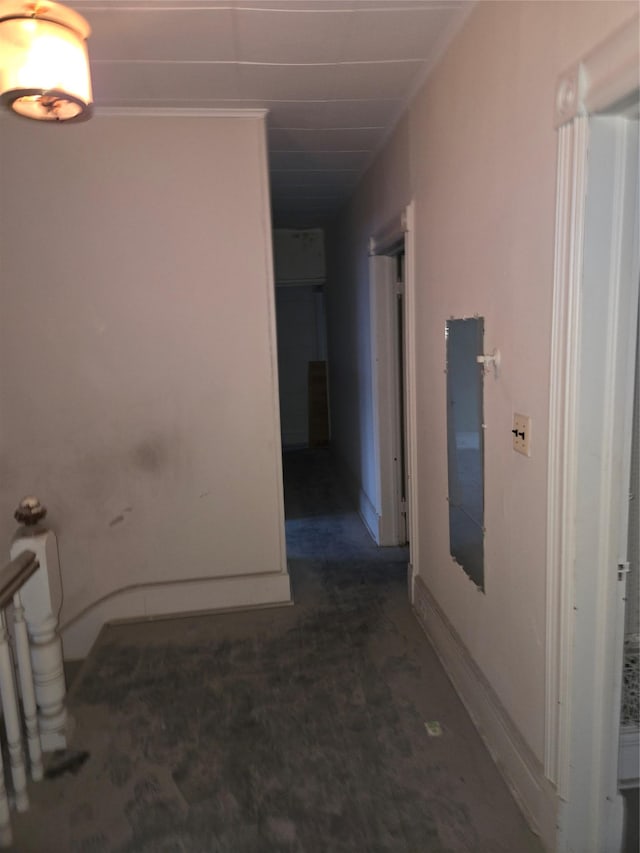 hallway featuring ornamental molding