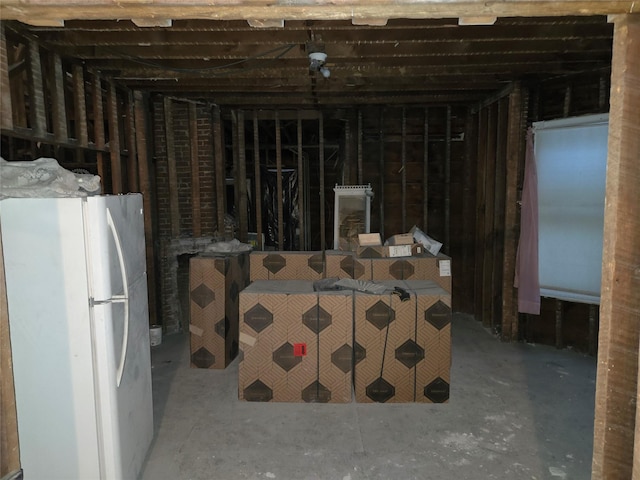 basement featuring white fridge