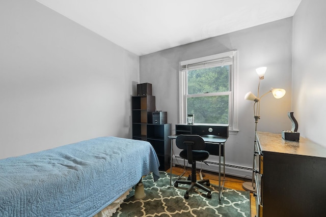 27 Stubbe Dr, Stony Point, NY 10980 - bedroom featuring a baseboard radiator, an office area, and wood finished floors