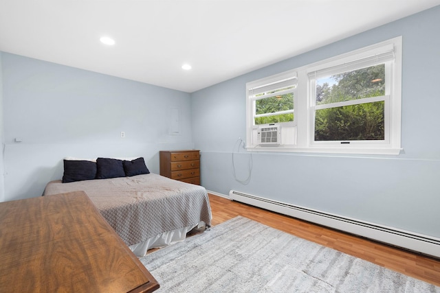 27 Stubbe Dr, Stony Point, NY 10980 - bedroom featuring a baseboard heating unit, cooling unit, wood finished floors, and recessed lighting