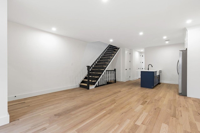 interior space featuring light hardwood / wood-style floors and sink