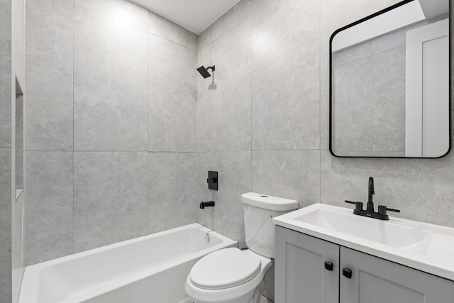 full bathroom featuring shower / tub combination, vanity, toilet, and tile walls