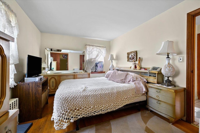 bedroom featuring hardwood / wood-style floors