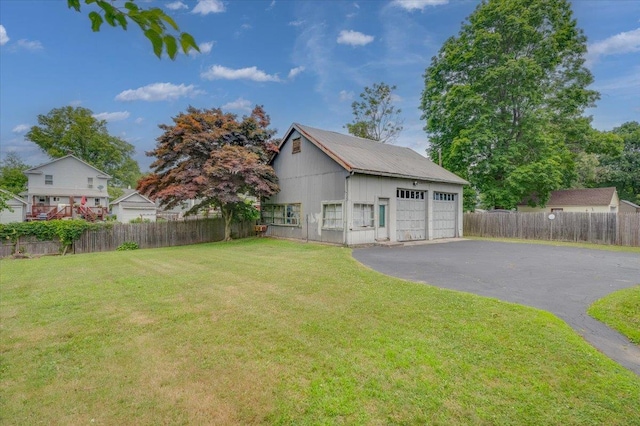 exterior space featuring a yard and an outdoor structure