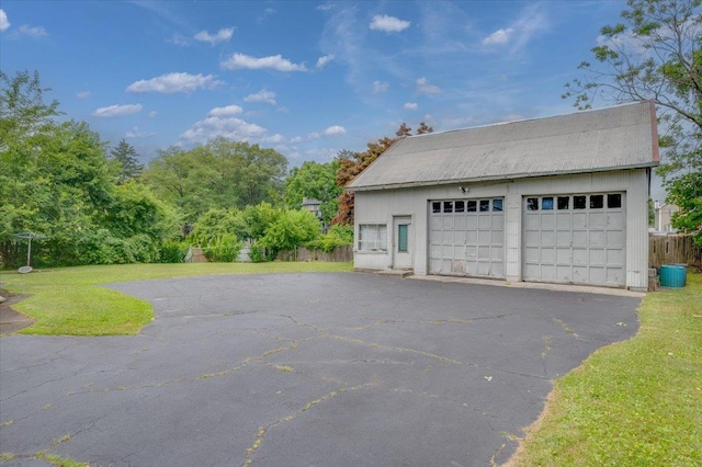 garage featuring a yard