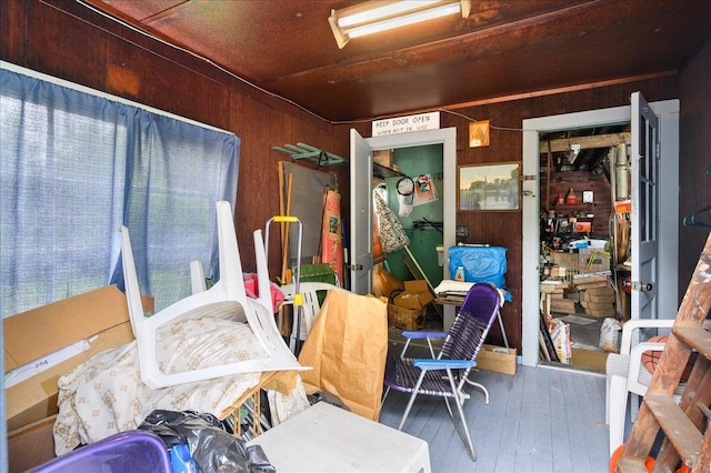 miscellaneous room featuring hardwood / wood-style floors and wood walls