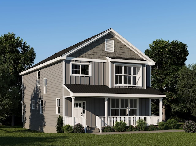 view of front facade with a front lawn and covered porch