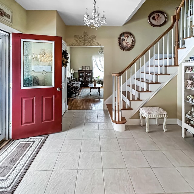 37 Woodcock Mtn Rd, Washingtonville, NY 10992 - entrance foyer featuring a chandelier, stairway, tile patterned flooring, and baseboards