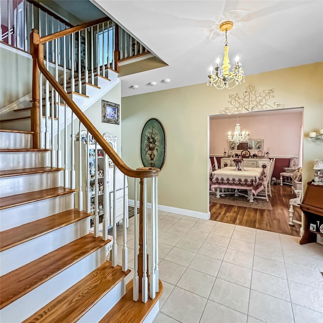 37 Woodcock Mtn Rd, Washingtonville, NY 10992 - stairway featuring a chandelier, tile patterned flooring, and baseboards