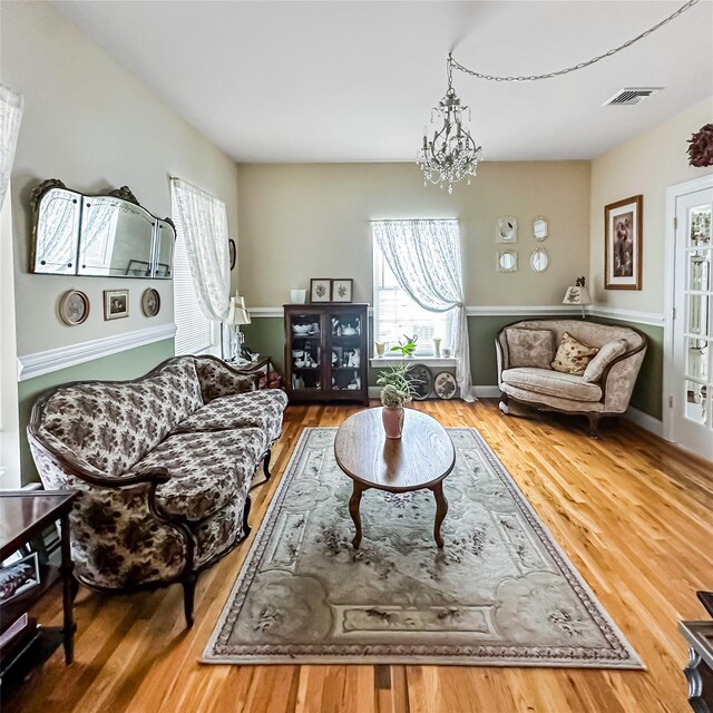 37 Woodcock Mtn Rd, Washingtonville, NY 10992 - living area with plenty of natural light, wood finished floors, and a chandelier