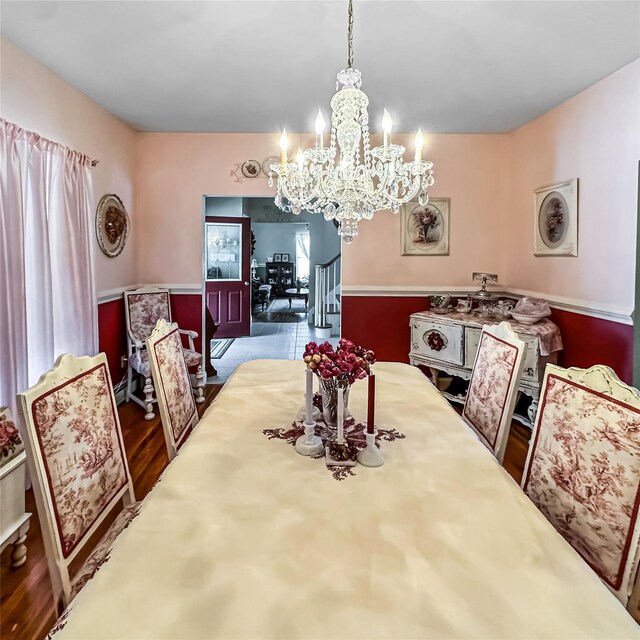37 Woodcock Mtn Rd, Washingtonville, NY 10992 - dining space with a chandelier, wood finished floors, and a wainscoted wall