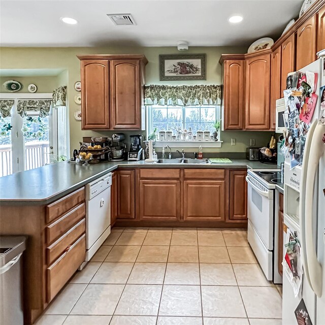 37 Woodcock Mtn Rd, Washingtonville, NY 10992 - kitchen with white appliances, a sink, a peninsula, dark countertops, and recessed lighting
