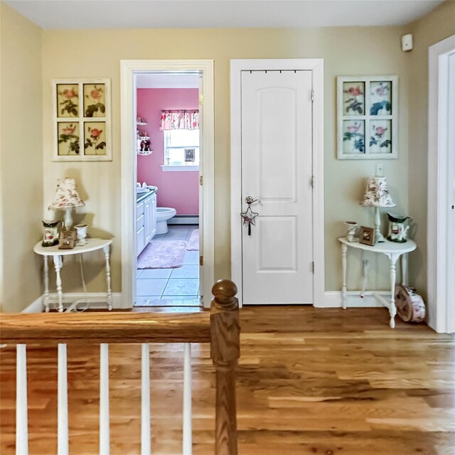37 Woodcock Mtn Rd, Washingtonville, NY 10992 - entryway with a baseboard heating unit, light wood-style flooring, and baseboards