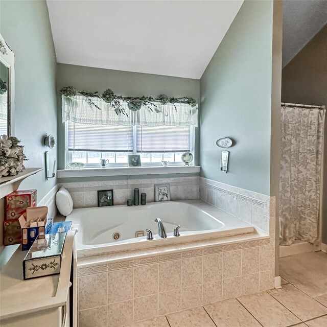 37 Woodcock Mtn Rd, Washingtonville, NY 10992 - bathroom with a tub with jets, tile patterned flooring, a shower with curtain, and vaulted ceiling