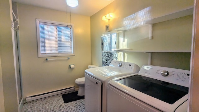 clothes washing area with tile patterned flooring, independent washer and dryer, and a baseboard heating unit