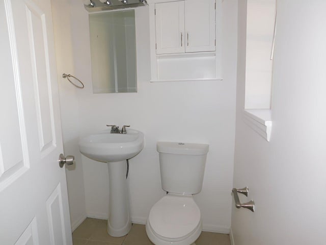 bathroom with tile patterned floors and toilet