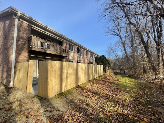 3 Woods End Cir Unit 3P, Peekskill, NY 10566 - view of home's exterior featuring a balcony and brick siding