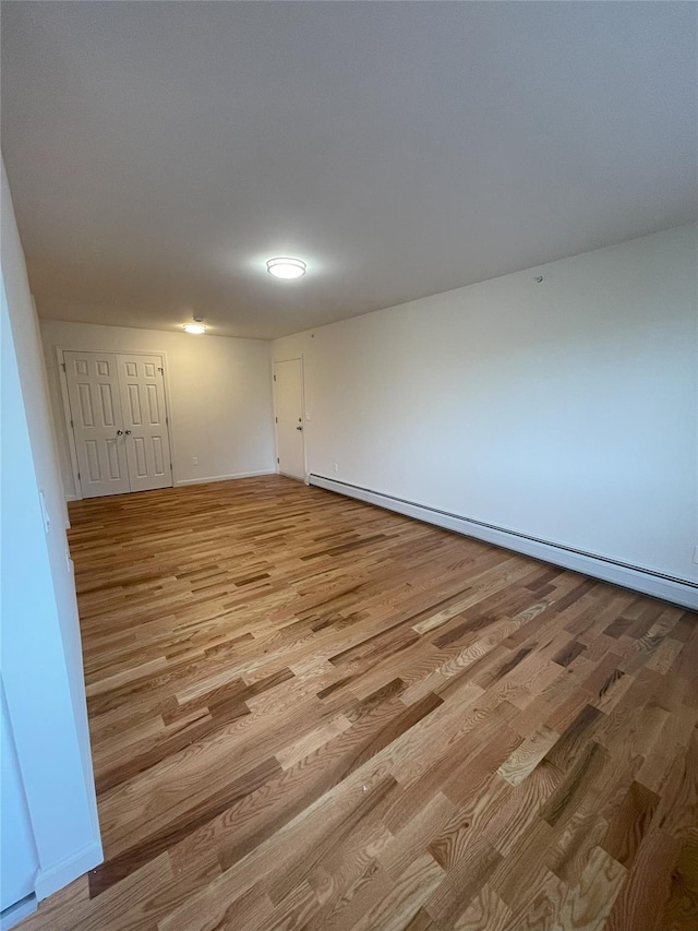 3 Woods End Cir Unit 3P, Peekskill, NY 10566 - spare room with baseboard heating and light wood-style floors