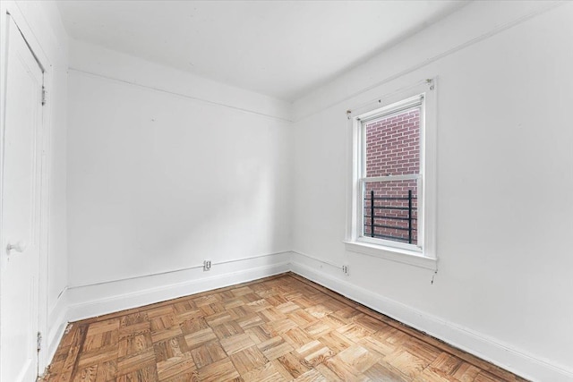 spare room featuring light parquet flooring