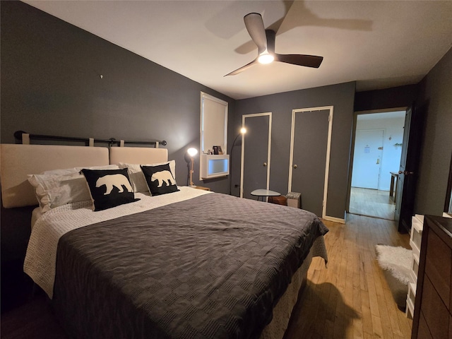 bedroom featuring ceiling fan and light wood-type flooring