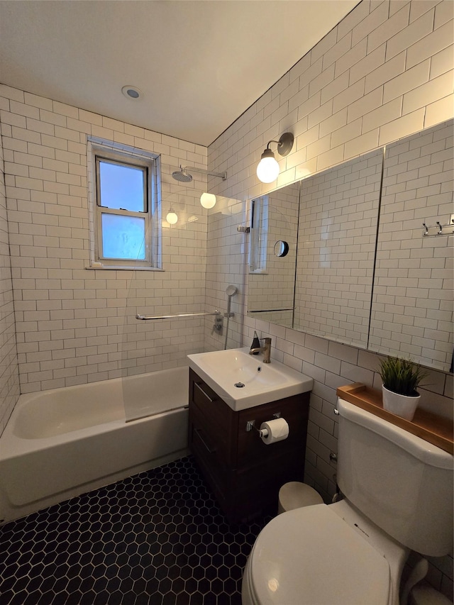 bathroom with tile patterned flooring and tiled shower