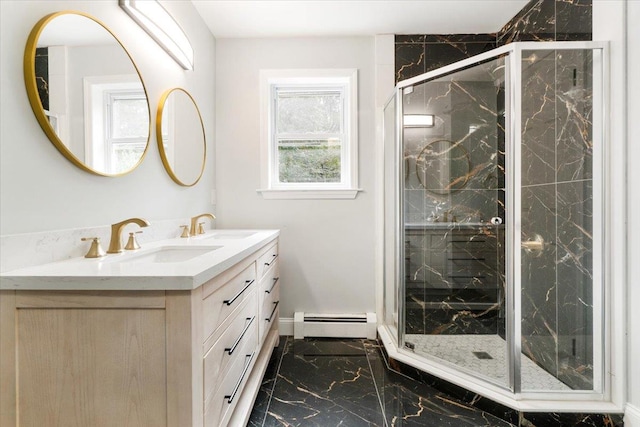 bathroom featuring baseboard heating, vanity, and a shower with shower door