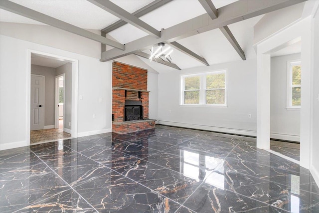 unfurnished living room with a wealth of natural light, lofted ceiling with beams, and a brick fireplace