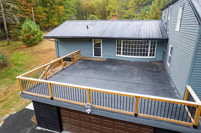 exterior space featuring a garage and a deck