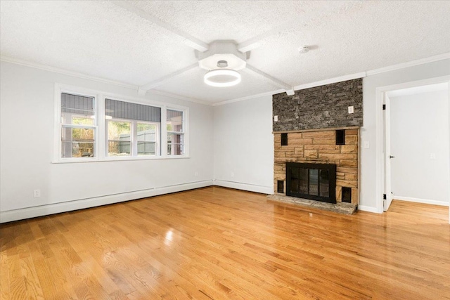 unfurnished living room featuring hardwood / wood-style floors, a fireplace, crown molding, and a textured ceiling