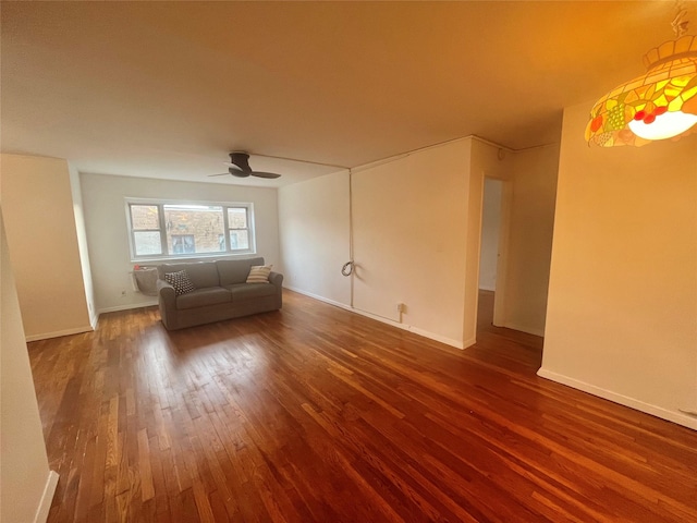 unfurnished living room featuring wood-type flooring and ceiling fan