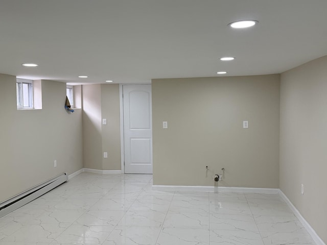 basement featuring a baseboard heating unit