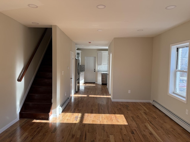 interior space featuring a baseboard radiator and dark wood-type flooring