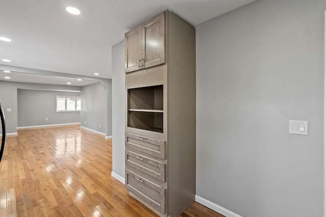 interior space featuring light brown cabinetry and light wood-type flooring