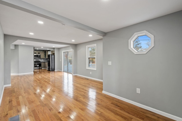 unfurnished living room featuring light hardwood / wood-style floors