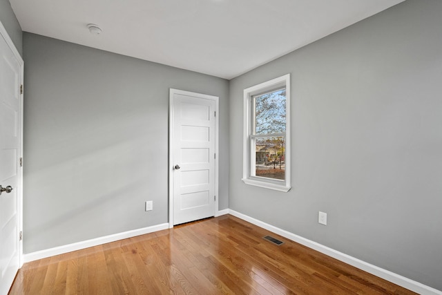 unfurnished room with light hardwood / wood-style floors