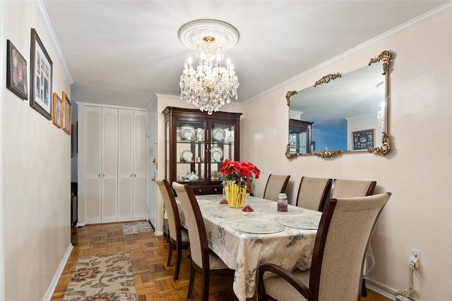 dining space featuring crown molding, parquet floors, and an inviting chandelier