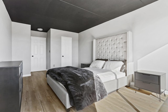 500 High Point Dr Unit 709, Hartsdale, NY 10530 - bedroom featuring wood finished floors and baseboards