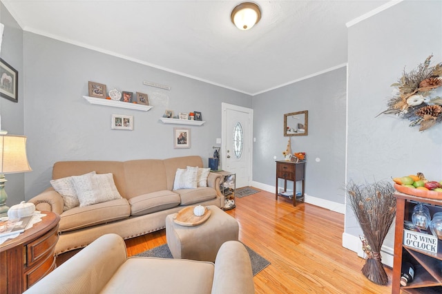 living room featuring hardwood / wood-style floors and ornamental molding