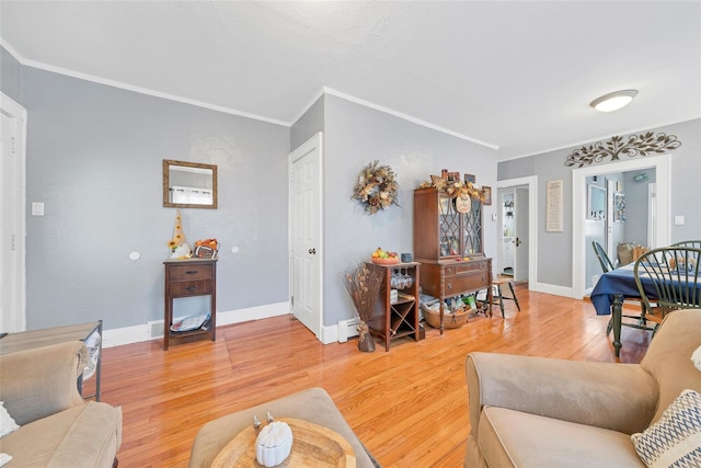 living room featuring wood-type flooring and ornamental molding