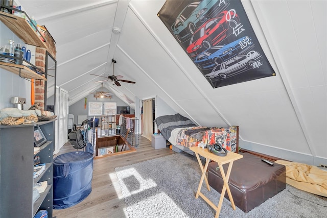 bedroom with hardwood / wood-style flooring and vaulted ceiling