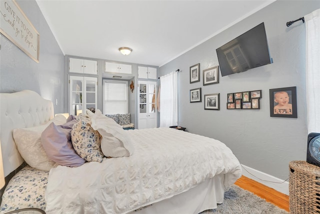 bedroom with hardwood / wood-style floors