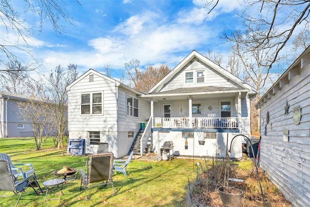 back of property with a porch and a lawn