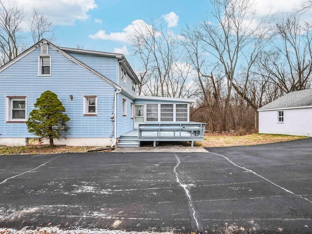 view of home's exterior with a deck