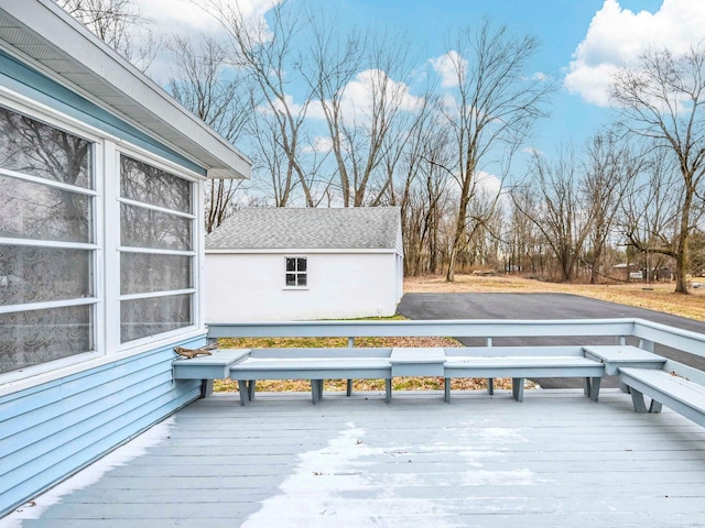 wooden deck with an outdoor structure