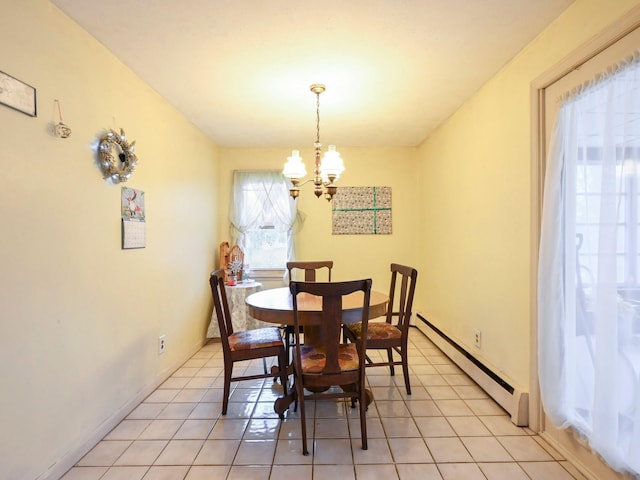 tiled dining space featuring a notable chandelier and a baseboard heating unit