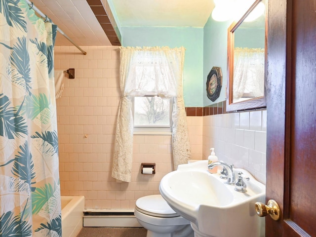 full bathroom featuring sink, a baseboard heating unit, tile walls, toilet, and shower / tub combo