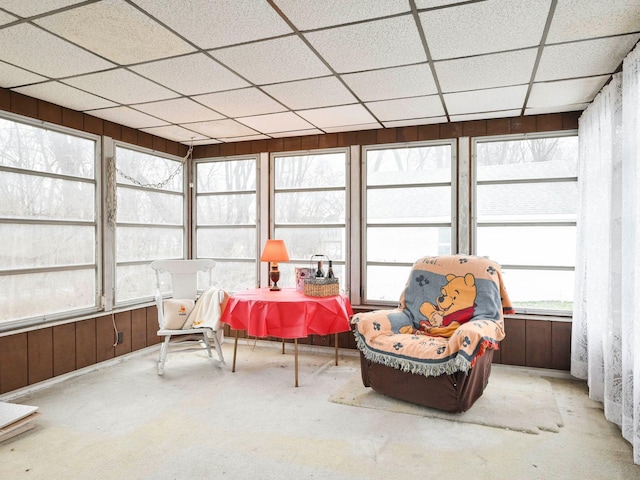 sunroom / solarium featuring a drop ceiling