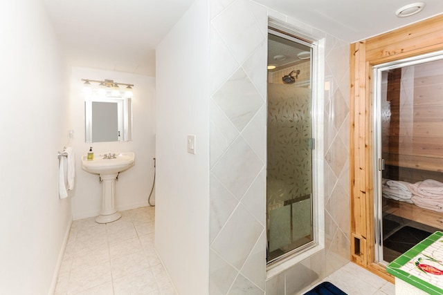full bathroom with tile patterned floors, baseboards, and a shower stall