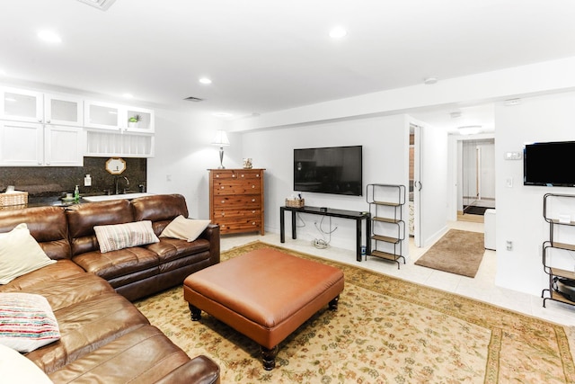living area with recessed lighting, visible vents, and light tile patterned floors